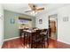 Dining room with a view features hardwood floors, a ceiling fan and seating for four at 11936 W Temple Dr, Morrison, CO 80465