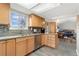 Kitchen with wood cabinets, granite countertop, stainless steel appliances, and mosaic backsplash at 11936 W Temple Dr, Morrison, CO 80465