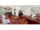 Living room with hardwood floors, comfortable leather seating, staircase and dining space at 11936 W Temple Dr, Morrison, CO 80465