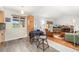 Open-concept room seamlessly connects kitchen, dining area, and living space for modern living at 11936 W Temple Dr, Morrison, CO 80465
