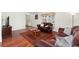Open floor plan living room features hardwood floors, an area rug and casual furniture at 11936 W Temple Dr, Morrison, CO 80465