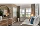 Serene bedroom featuring a large window, plantation shutters, and stylish decor, offering a peaceful retreat at 13342 Blue Amber Ct, Parker, CO 80134