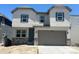Charming two-story home with neutral siding, stone accents, and an attached two-car garage at 13342 Blue Amber Ct, Parker, CO 80134