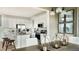 Bright kitchen and dining area featuring modern decor, white cabinets, and stainless steel appliances at 13342 Blue Amber Ct, Parker, CO 80134