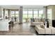 Open-concept living space with seamless flow to dining area and access to outdoor living space at 13342 Blue Amber Ct, Parker, CO 80134