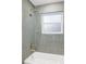 Clean bathroom with a shower and a bathtub at 917 S Owens Ct, Lakewood, CO 80226