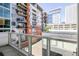 Apartment balcony view overlooking city buildings at 1467 Delgany St # 1, Denver, CO 80202
