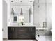 Modern bathroom with double vanity, large mirror and a glass shower at 1467 Delgany St # 1, Denver, CO 80202