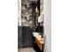 Stylish powder room with black and white wallpaper, sleek vanity, unique pendant lights, and modern fixtures at 1467 Delgany St # 1, Denver, CO 80202