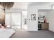 Open view of bedroom with wet bar, with sleek cabinets and a modern design at 1467 Delgany St # 1, Denver, CO 80202