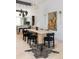 Open dining area with stairs, modern light fixtures, and decorative zebra rug at 1467 Delgany St # 1, Denver, CO 80202