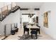 Open dining area with stairs, modern light fixtures, and decorative zebra rug at 1467 Delgany St # 1, Denver, CO 80202
