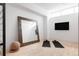 Bright exercise room with light wood floors, large mirror, and TV, perfect for home workouts at 1467 Delgany St # 1, Denver, CO 80202