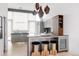 Contemporary kitchen with gray cabinets, a mini fridge and unique island seating at 1467 Delgany St # 1, Denver, CO 80202