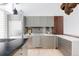 Modern kitchen featuring sleek cabinetry, stainless steel appliances, and a contrasting dark countertop island at 1467 Delgany St # 1, Denver, CO 80202
