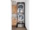 A well-organized laundry room featuring a stackable washer and dryer set at 1467 Delgany St # 1, Denver, CO 80202