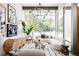 Bright living room features large windows, modern decor, and stylish furniture at 1467 Delgany St # 1, Denver, CO 80202