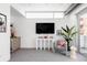 Bright living room with modern furnishings, including a comfortable chair and sleek table at 1467 Delgany St # 1, Denver, CO 80202