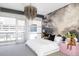 Bright main bedroom featuring a cloud mural, chandelier, and balcony access at 1467 Delgany St # 1, Denver, CO 80202