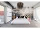 Bright main bedroom featuring a cloud mural, chandelier, and dual access to balcony at 1467 Delgany St # 1, Denver, CO 80202