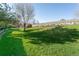 Lush green backyard offering ample space for outdoor activities at 2901 W Rowland Ave, Littleton, CO 80120