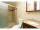 Bathroom includes a shower, single sink vanity, and tile flooring at 2901 W Rowland Ave, Littleton, CO 80120