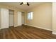 A bright bedroom with closet and vinyl flooring at 2901 W Rowland Ave, Littleton, CO 80120