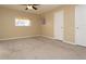 Cozy bedroom with carpet floors, neutral walls, and a window providing natural light at 2901 W Rowland Ave, Littleton, CO 80120