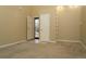 Inviting entryway with carpet and tile flooring and an open door letting in natural light at 2901 W Rowland Ave, Littleton, CO 80120