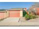 Charming home featuring a two-car garage, brick accents, and a well-maintained front yard at 2901 W Rowland Ave, Littleton, CO 80120