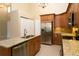 Bright kitchen featuring granite countertops, stainless steel appliances, and ample cabinet space at 2901 W Rowland Ave, Littleton, CO 80120