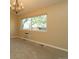 Cozy living room with a large window providing ample natural light and backyard views at 2901 W Rowland Ave, Littleton, CO 80120
