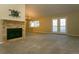Bright living room with a fireplace, offering plenty of space for relaxation and entertainment at 2901 W Rowland Ave, Littleton, CO 80120