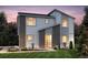 Modern two-story home featuring charming accents, lush landscaping, and a welcoming entrance at 23991 E 40Th Ave, Aurora, CO 80019