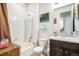 Bright bathroom featuring a shower over tub and a stylish vanity for a clean and modern feel at 17217 E Exposition Dr, Aurora, CO 80017