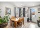 Small dining area with wooden table and chairs, near kitchen at 17217 E Exposition Dr, Aurora, CO 80017