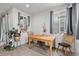 Bright dining area with hardwood floors and windows with decorative curtains for a cozy and inviting space at 17217 E Exposition Dr, Aurora, CO 80017