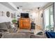 Inviting living room with a comfortable seating area, wooden cabinet, and bright natural light at 17217 E Exposition Dr, Aurora, CO 80017