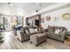 Spacious living room featuring hardwood floors and ample natural light at 17217 E Exposition Dr, Aurora, CO 80017