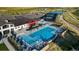 Community pool and clubhouse with surrounding park and parking areas at 5015 N Quemoy St, Aurora, CO 80019