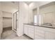 Double vanity bathroom with gray countertops and a shower at 5015 N Quemoy St, Aurora, CO 80019