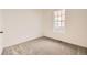 Simple bedroom with gray carpet and a window at 5015 N Quemoy St, Aurora, CO 80019