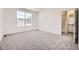 Main bedroom with en-suite bathroom and gray carpet at 5015 N Quemoy St, Aurora, CO 80019