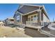 Ranch style home with covered deck and landscaped yard at 5015 N Quemoy St, Aurora, CO 80019