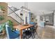 Bright dining area with modern chandelier and access to kitchen with stainless steel appliances at 595 W 174Th Pl, Broomfield, CO 80023