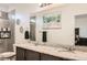 Bathroom featuring double sinks, granite countertops, and a shower at 5332 13Th St, Frederick, CO 80504