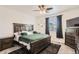 Comfortable bedroom featuring a ceiling fan and a window with blinds at 5332 13Th St, Frederick, CO 80504