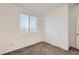A bedroom featuring neutral walls, carpet flooring, a window with blinds, and a closet at 5332 13Th St, Frederick, CO 80504