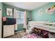 ' bedroom featuring a bunk bed, dresser, TV, and colorful decor at 5332 13Th St, Frederick, CO 80504
