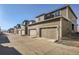 A row of townhome garages with ample parking space and modern design in a residential community at 5332 13Th St, Frederick, CO 80504